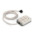 The Shinola 5 Port Power Supply - Stone features six outlets and two USB ports on a silver rectangular base, connected to a white braided extension cord with black accents and a black plug.