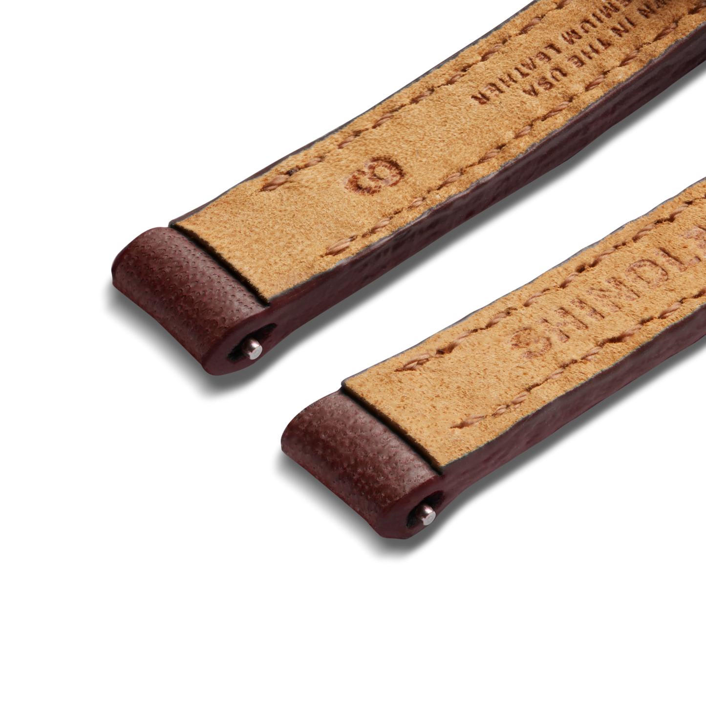 Two 8mm Merlot leather watch strap ends by Shinola, with visible stitching and metal rivets, are shown on a white background. The underside reveals stamped branding and the natural texture of the Merlot leather.