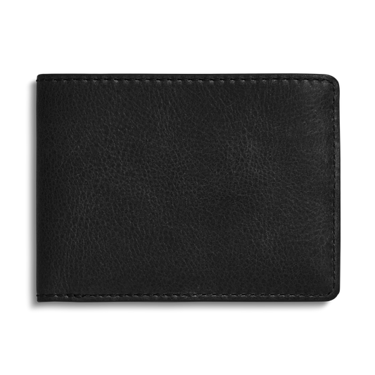 The Shinola Slim Bifold Wallet - Black, crafted from premium leather with visible stitching, is displayed closed against a plain white background, highlighting its elegant and minimalist design.