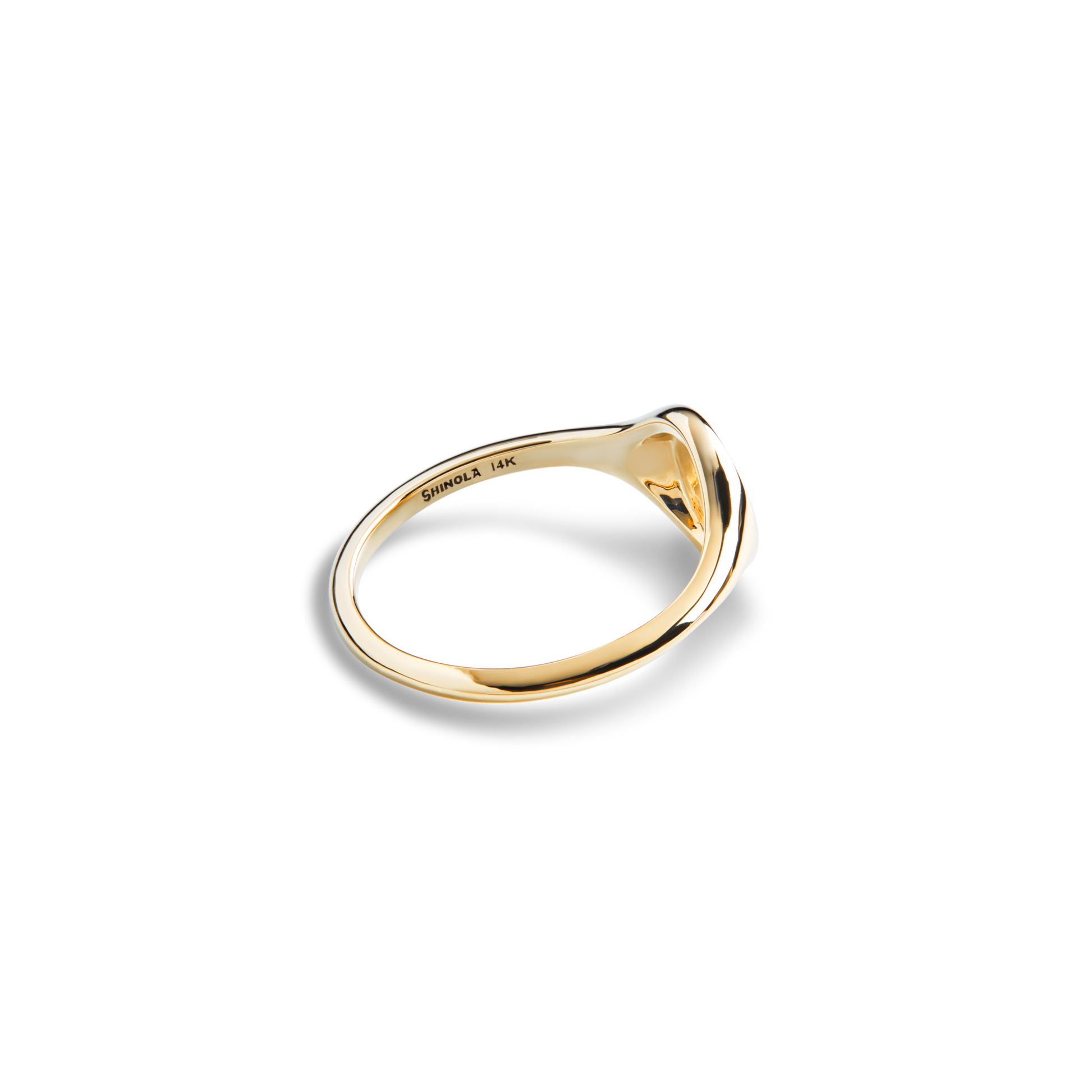 The Shinola Petite Round Signet Ring in 14k yellow gold features a sleek, polished design that exudes timeless elegance, shown against a plain white background.