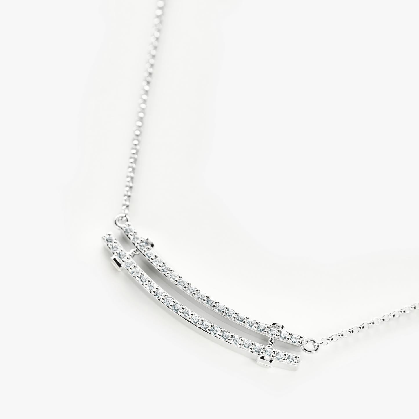 The Shinola Diamond Pave Rivet Double Row Necklace in 14k White Gold features two parallel, gem-encrusted bars on a fine chain, beautifully displayed against a white background.