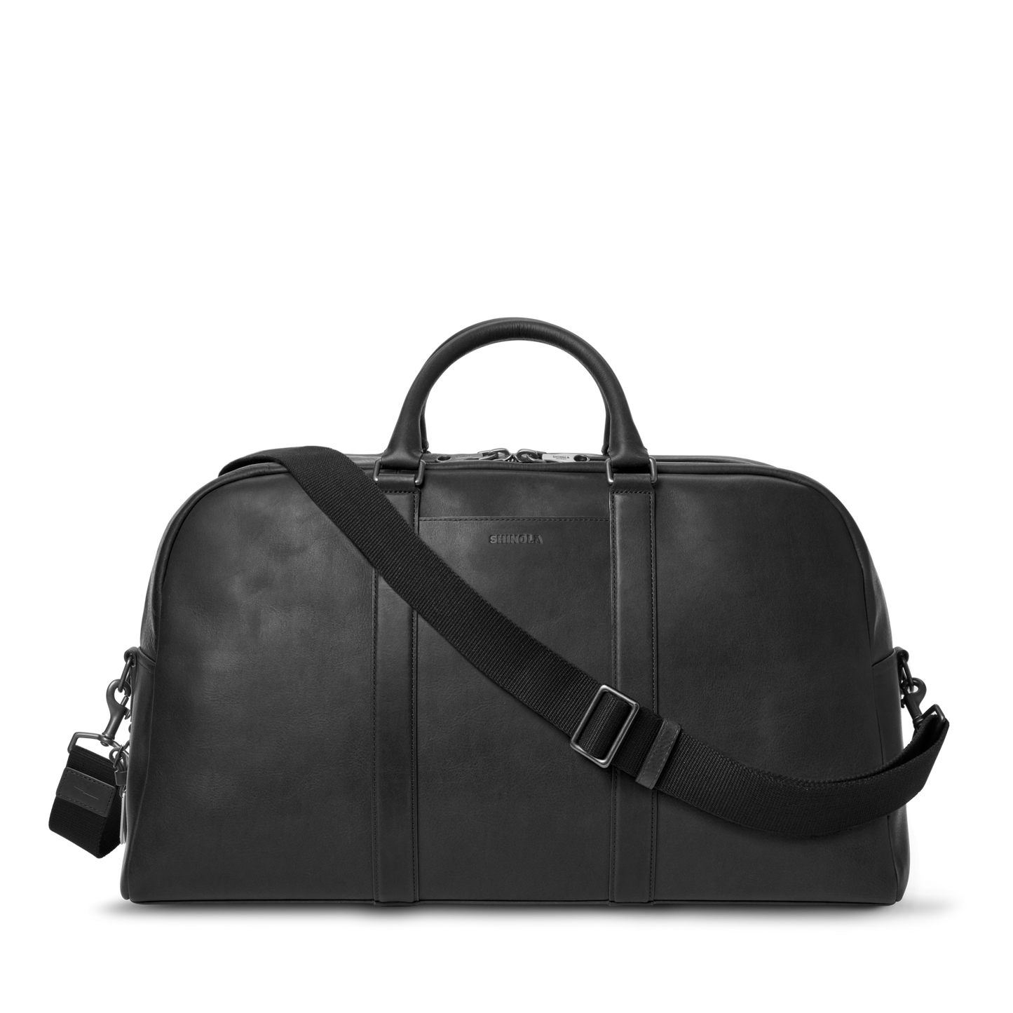 The Shinola Runwell Duffle Bag - Black features premium Navigator leather, two short handles, a detachable adjustable shoulder strap, and a small padlock—ideal as your next carry-on bag. Displayed against a white background.