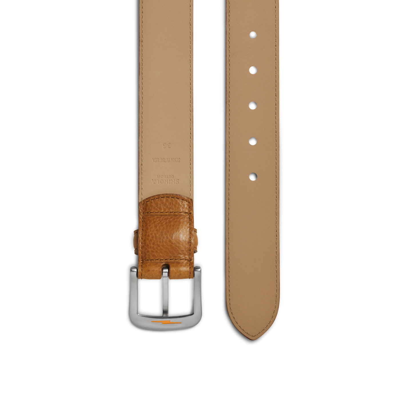 A close-up of the Shinola 1 1/2" Canfield Belt - Bourbon, crafted from premium Italian Vachetta leather with stitched edges, belt holes, and embossed inner branding, is shown flat on a white background.