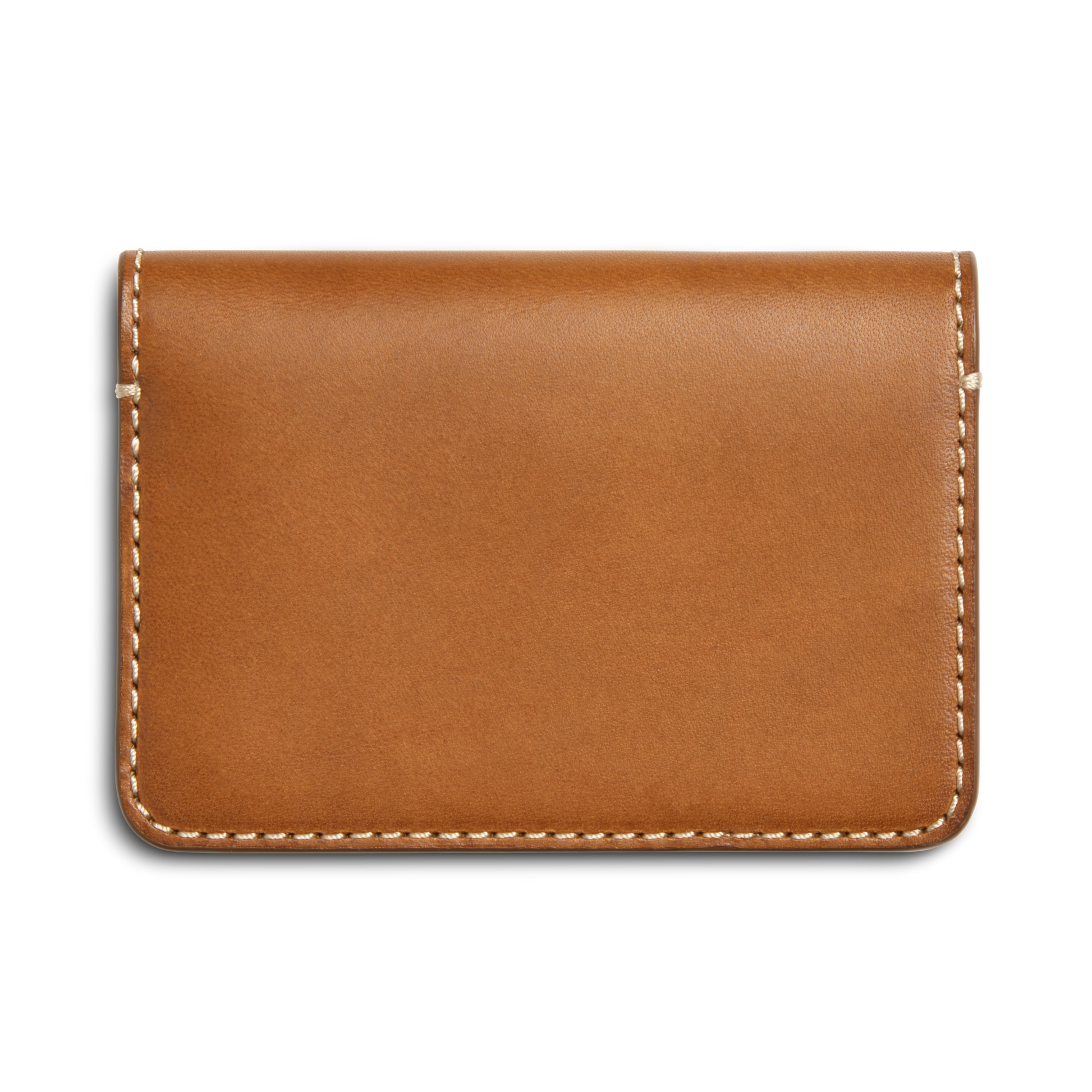 The Shinola Business Card Holder - Tan, crafted from Italian Vachetta leather with white edge stitching, is shown on a white background. Ideal for monogramming, it adds a custom touch to your professional essentials.