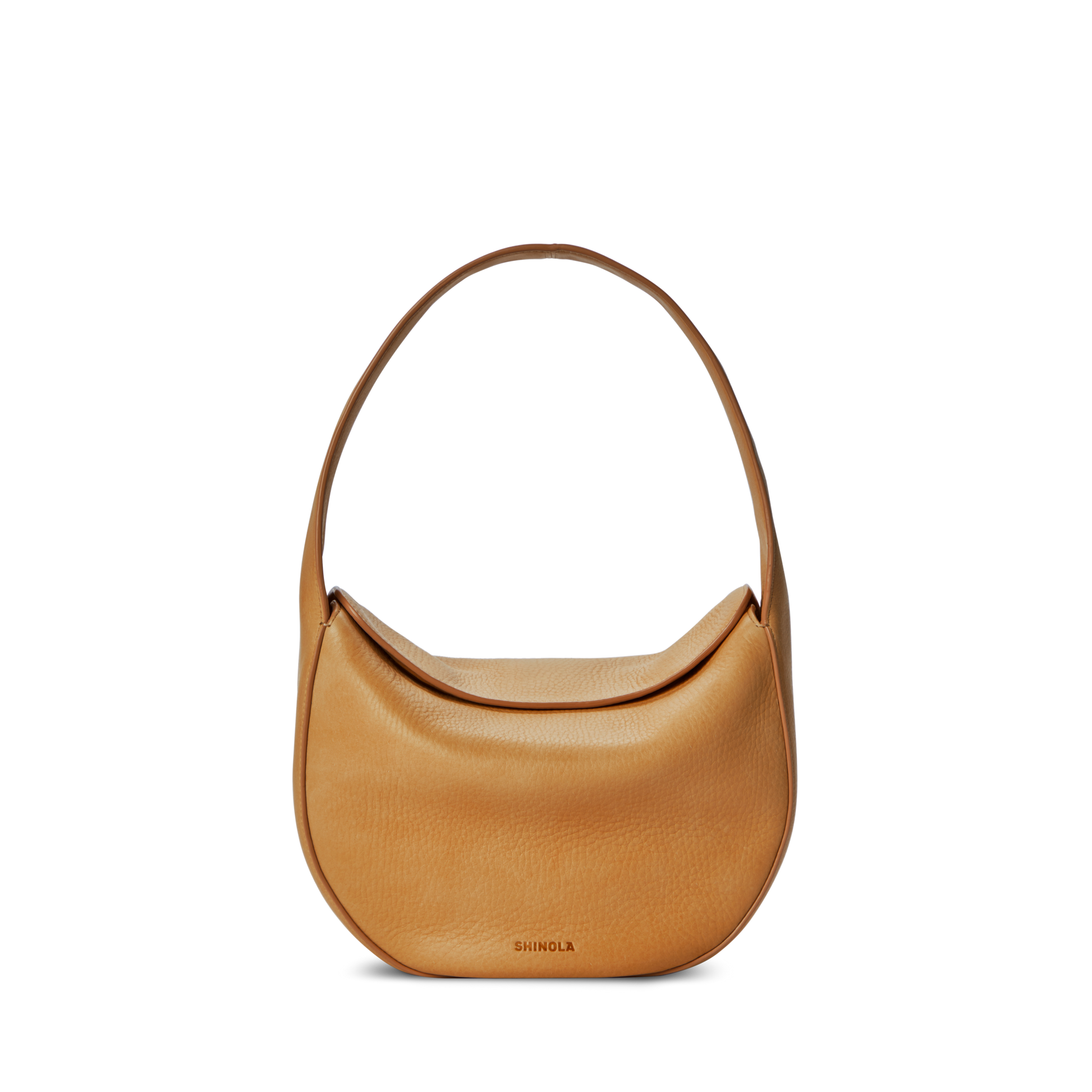 The Shinola Small Shoulder Bag - Honey features premium tan leather, a curved crescent shape, and a single wide strap. "SHINOLA" is subtly embossed on the lower front. Shown against a plain white background.