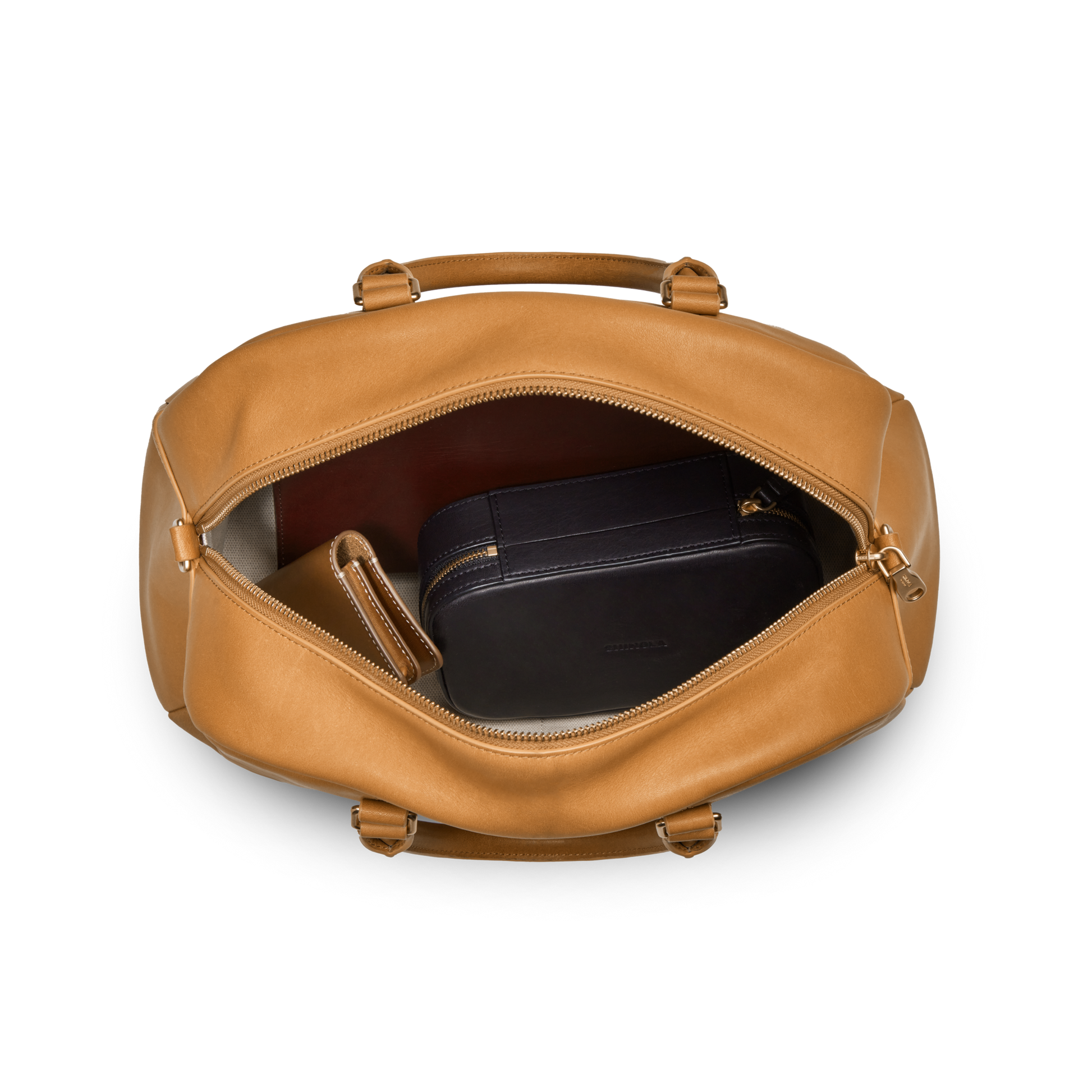 The Shinola Runwell Satchel - Honey is a premium tan natural leather duffel bag shown unzipped to reveal a black zippered pouch and brown wallet inside, all against a white background.