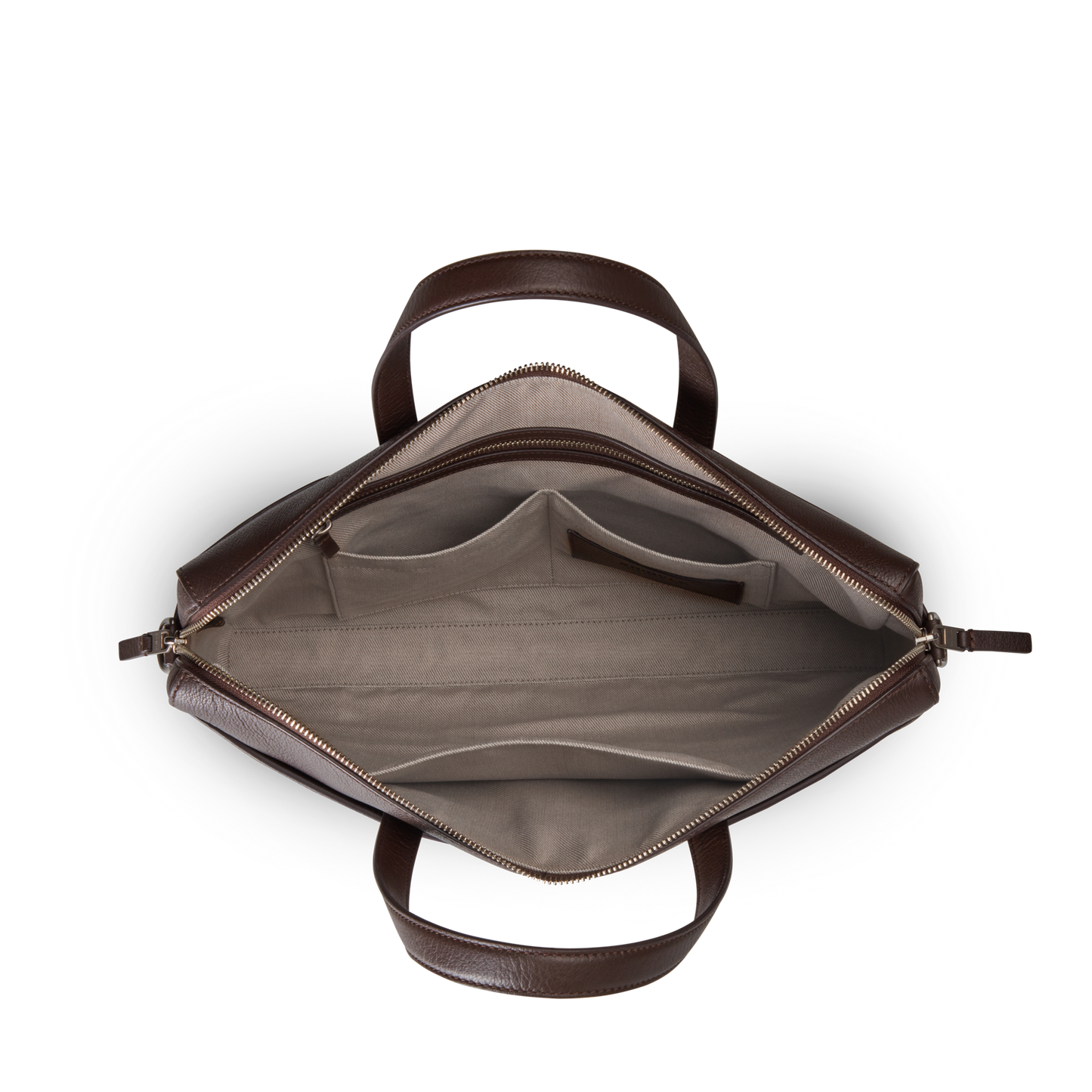 Top-down view of an open Shinola Canfield Briefcase - Espresso in brown pebbled leather with beige fabric lining, featuring a laptop pocket, two main compartments, interior pockets, and sturdy handles. The bag is empty and neatly organized.