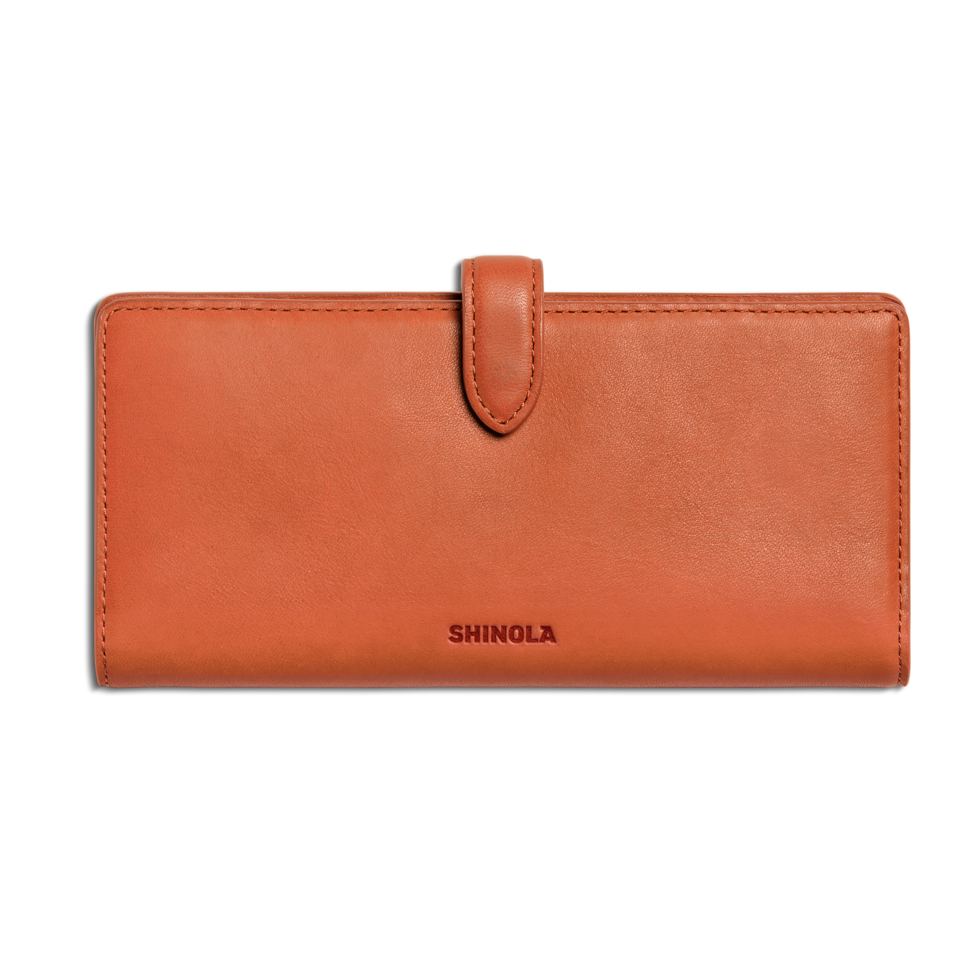 The Continental Snap Wallet - Rust by Shinola is a rectangular orange slim wallet crafted from natural leather with a snap tab closure, featuring the SHINOLA logo embossed on the front. Shown closed against a white background.