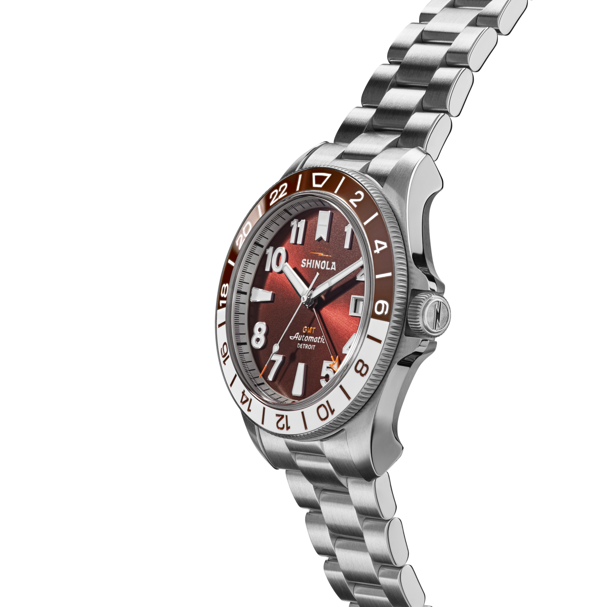 The Shinola Monster GMT Automatic Watch - Whiskey features a stainless steel case, silver metal band, brown and silver bezel, red gradient dial with white numerals and indices, and automatic movement.