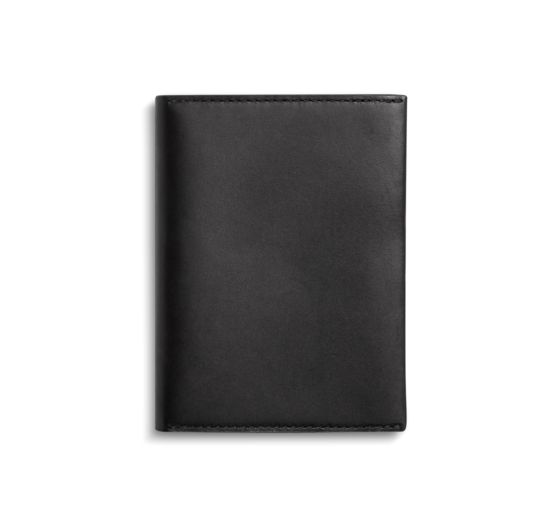The Shinola Passport Holder - Black is a closed, rectangular Italian Vachetta leather accessory with clean edges and visible stitching, shown against a plain white background for an elegant travel look.