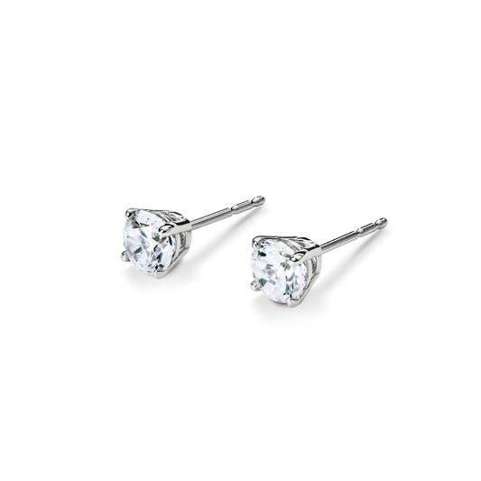 A pair of Shinola 1 Carat Round Diamond Studs in white gold, each featuring a brilliant round-cut diamond in a classic setting, elegantly displayed on a white background for timeless style.