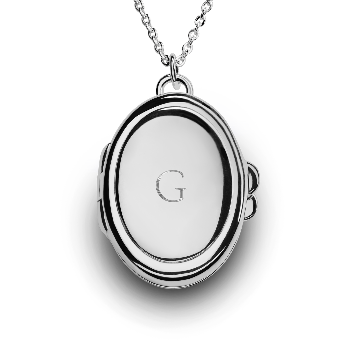 The Heirloom Petite Locket Necklace by Shinola features a sterling silver pendant engraved with the letter G, displayed on a chain against a white background.
