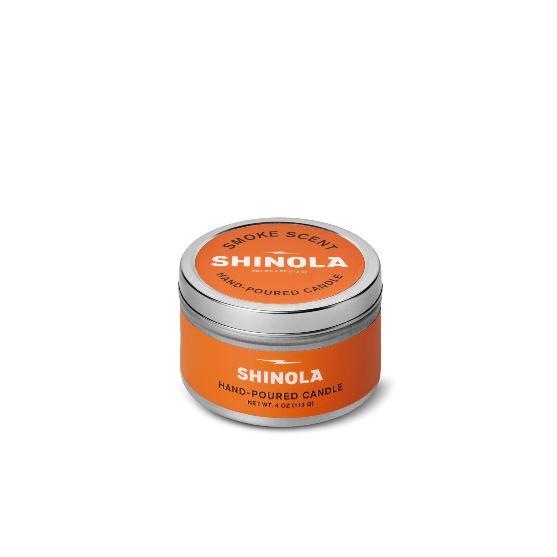 A small orange tin labeled "Shinola Hand Poured 4oz Travel Candle - Smoke," crafted from coconut soy wax with a silver lid and white text, sits on a white background—reflecting Detroit’s signature style.