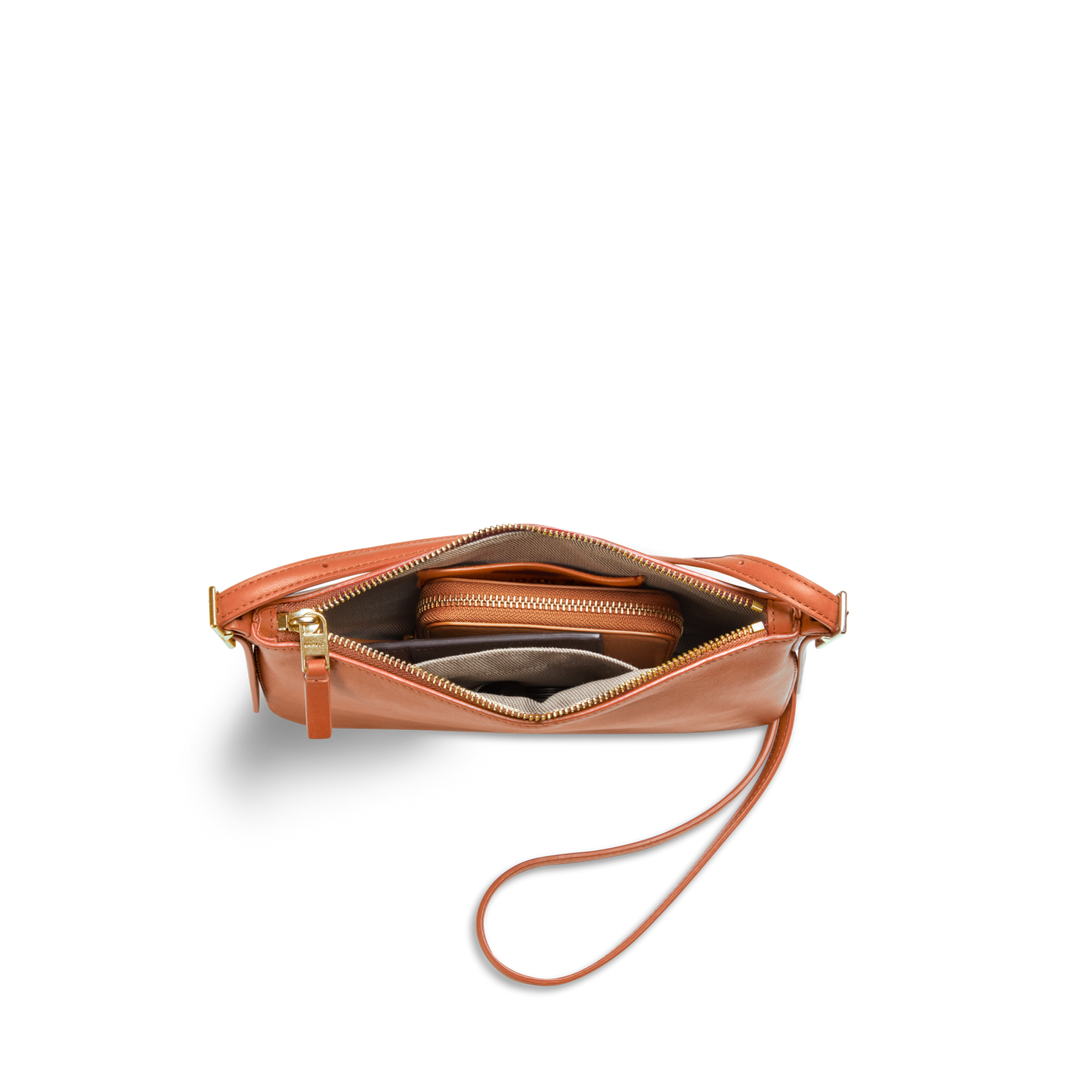 The Shinola Small Bixby Crossbody in Rust is shown from above with its zipper open, revealing a wallet and other items inside against a white background—an ideal everyday accessory.