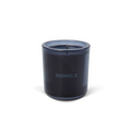 The Shinola Rhythm 8 oz Scented Candle features a dark blue recycled glass holder with "SHINOLA" on the front and a blue coconut soy single-wick candle, displayed against a plain white background.