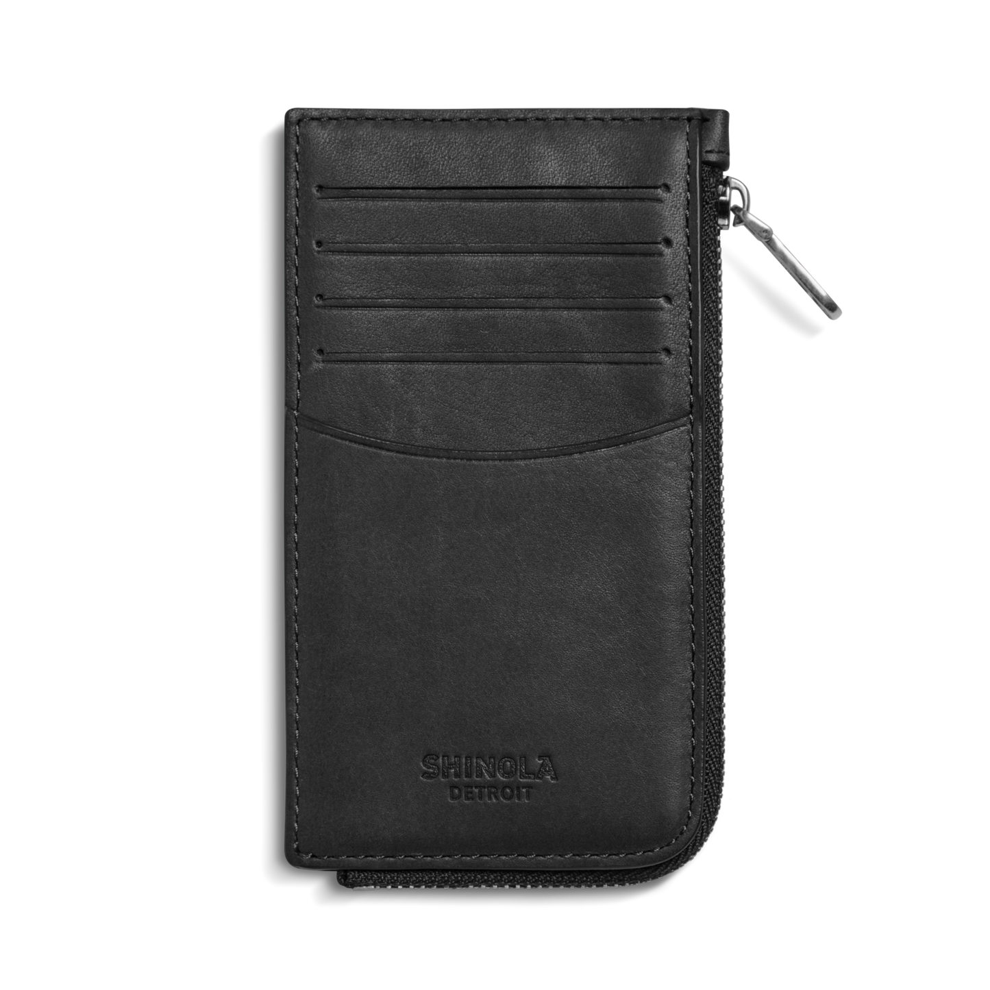 The Birdy Zip Around Card Holder in black by Shinola features four card slots, a curved pocket, and embossed branding on the front. Shown here in natural leather against a white background.