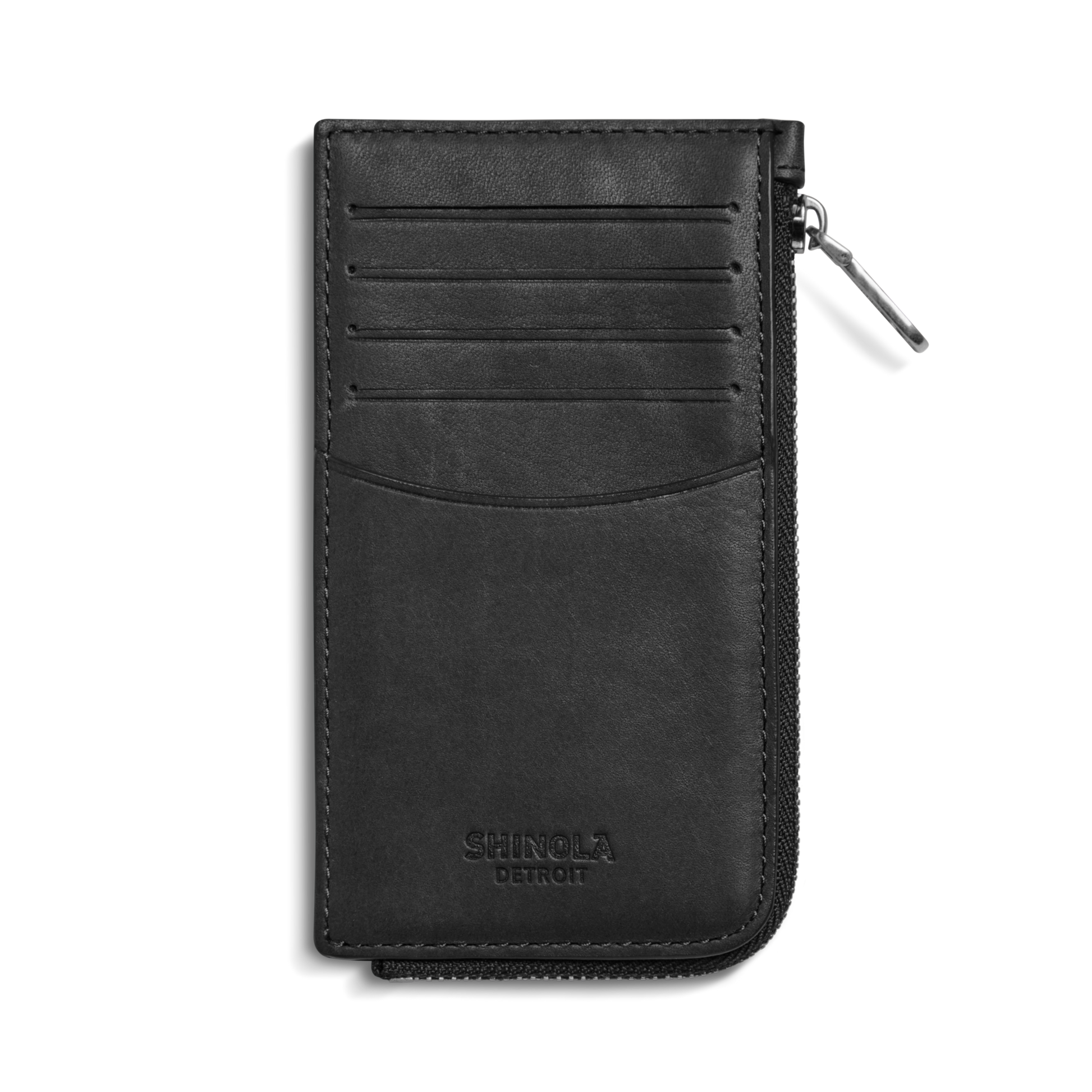 The Birdy Zip Around Card Holder in black by Shinola features four card slots, a curved pocket, and embossed branding on the front. Shown here in natural leather against a white background.