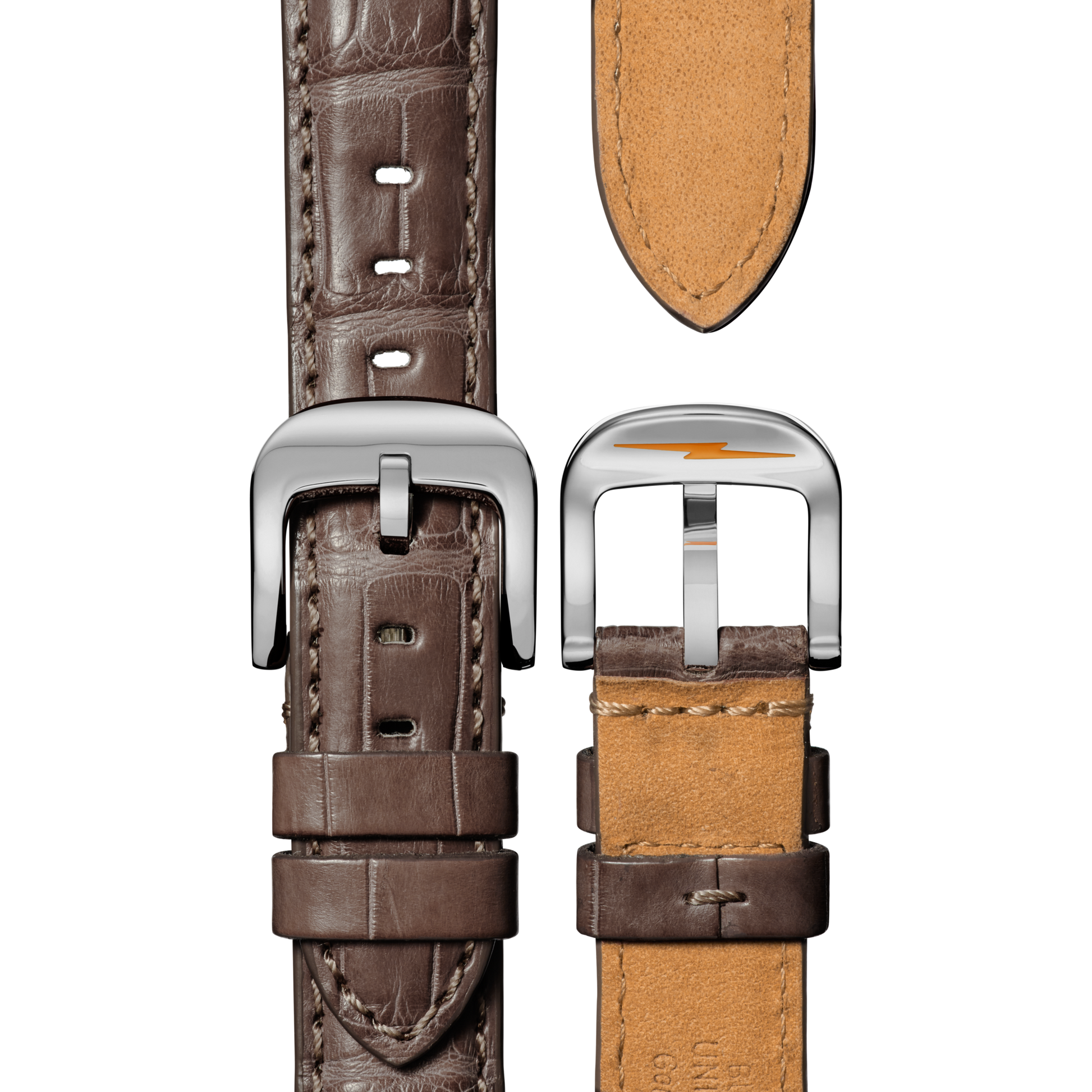 Close-up of two Shinola Canfield Watch gray brown alligator straps with silver buckles. One strap displays the American alligator leather texture and stitching; the other shows the tan leather underside.