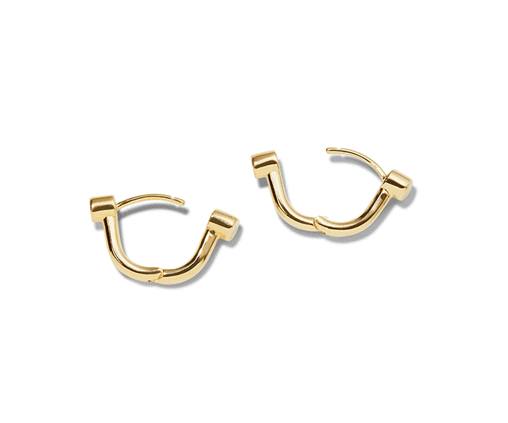 The Shinola Bike Lock Huggie Earrings in yellow gold feature a modern, angular design with a curved, segmented structure and latch-back closure—perfect for daily wear, shown on a white background.