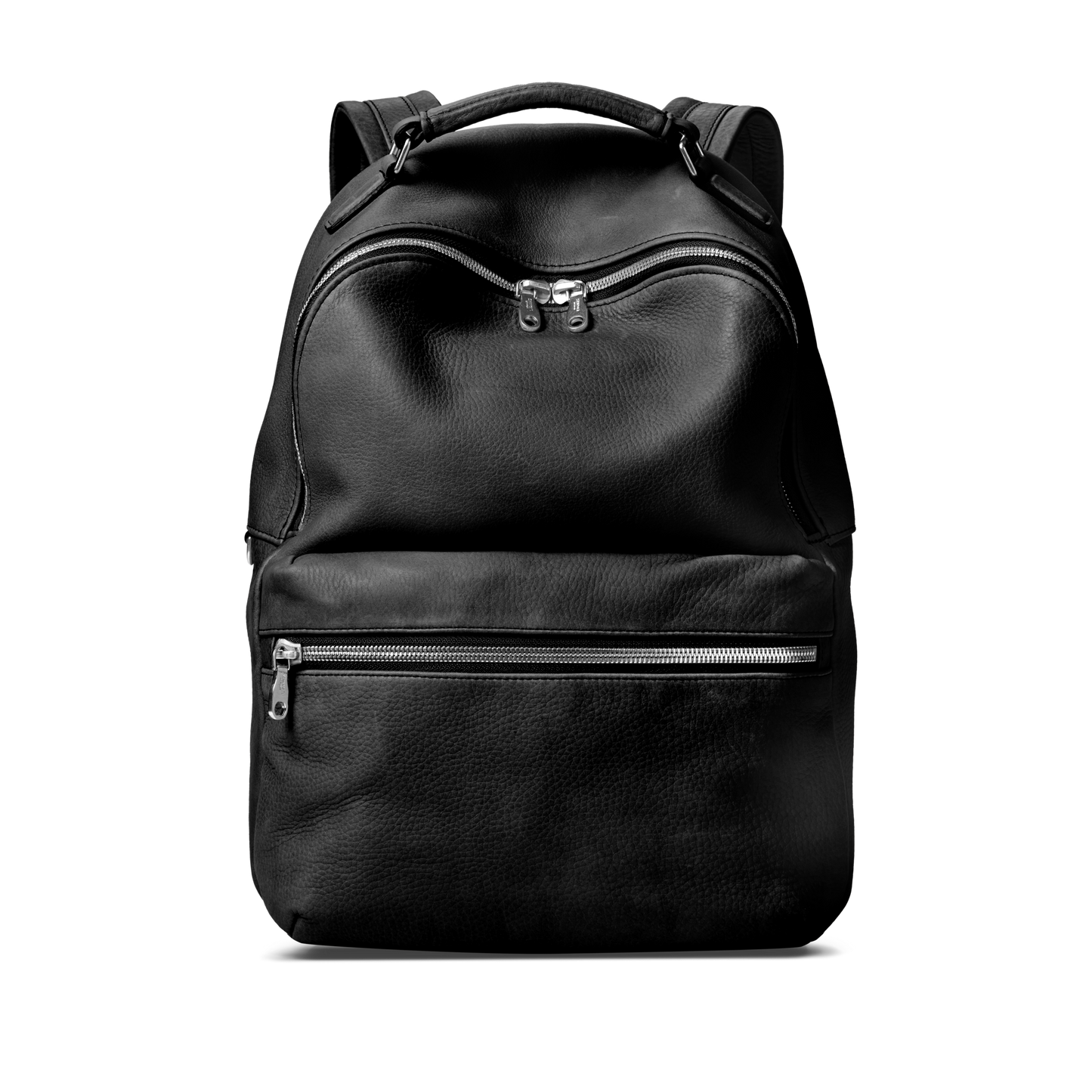 The Shinola Runwell Backpack - Black is a premium black leather backpack with a top handle, large main zippered pocket, and smaller front zip compartment, shown on a plain white background.