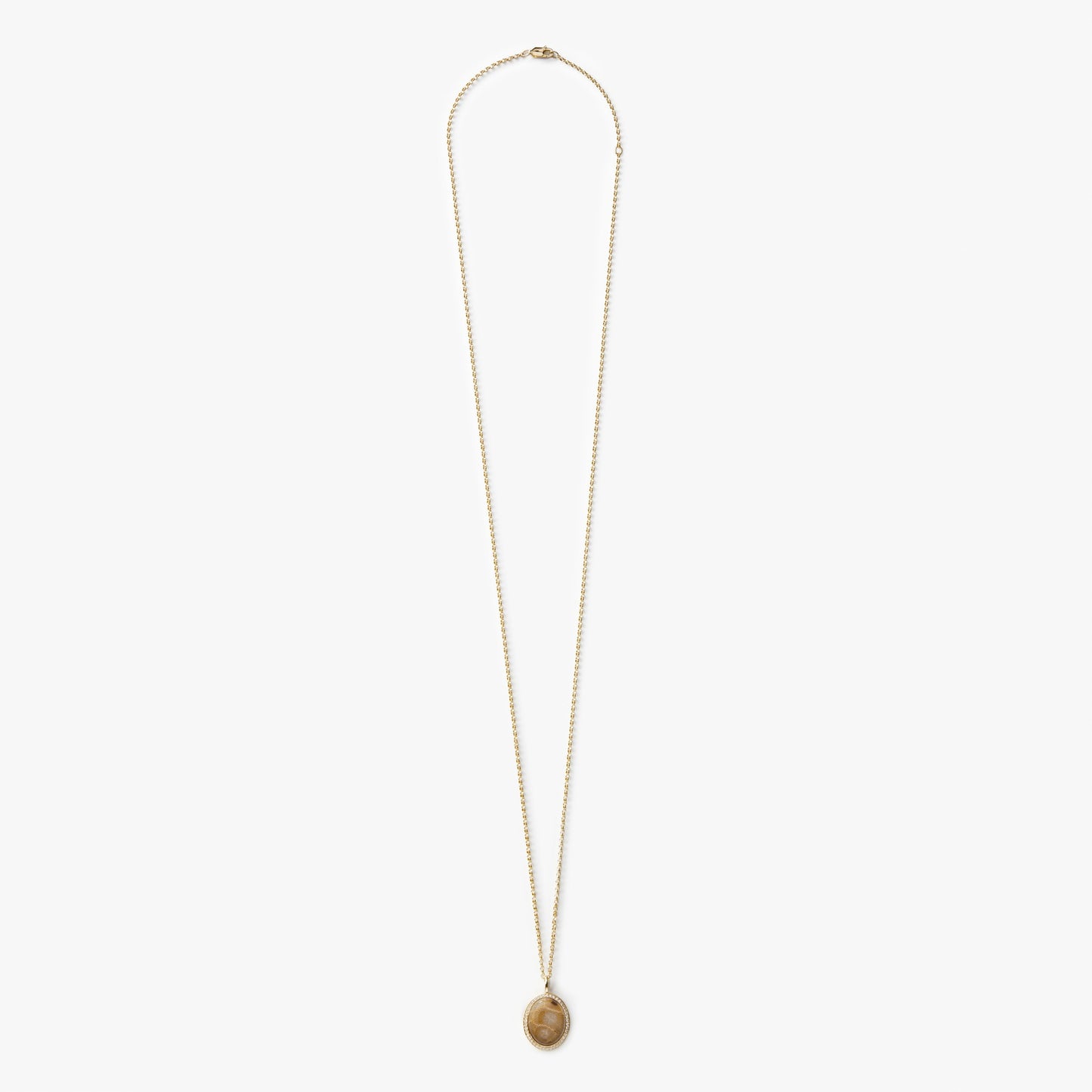 The Shinola Diamond Pave Petoskey Necklace in yellow gold features a round pendant with diamond accents, displayed on a plain white background.