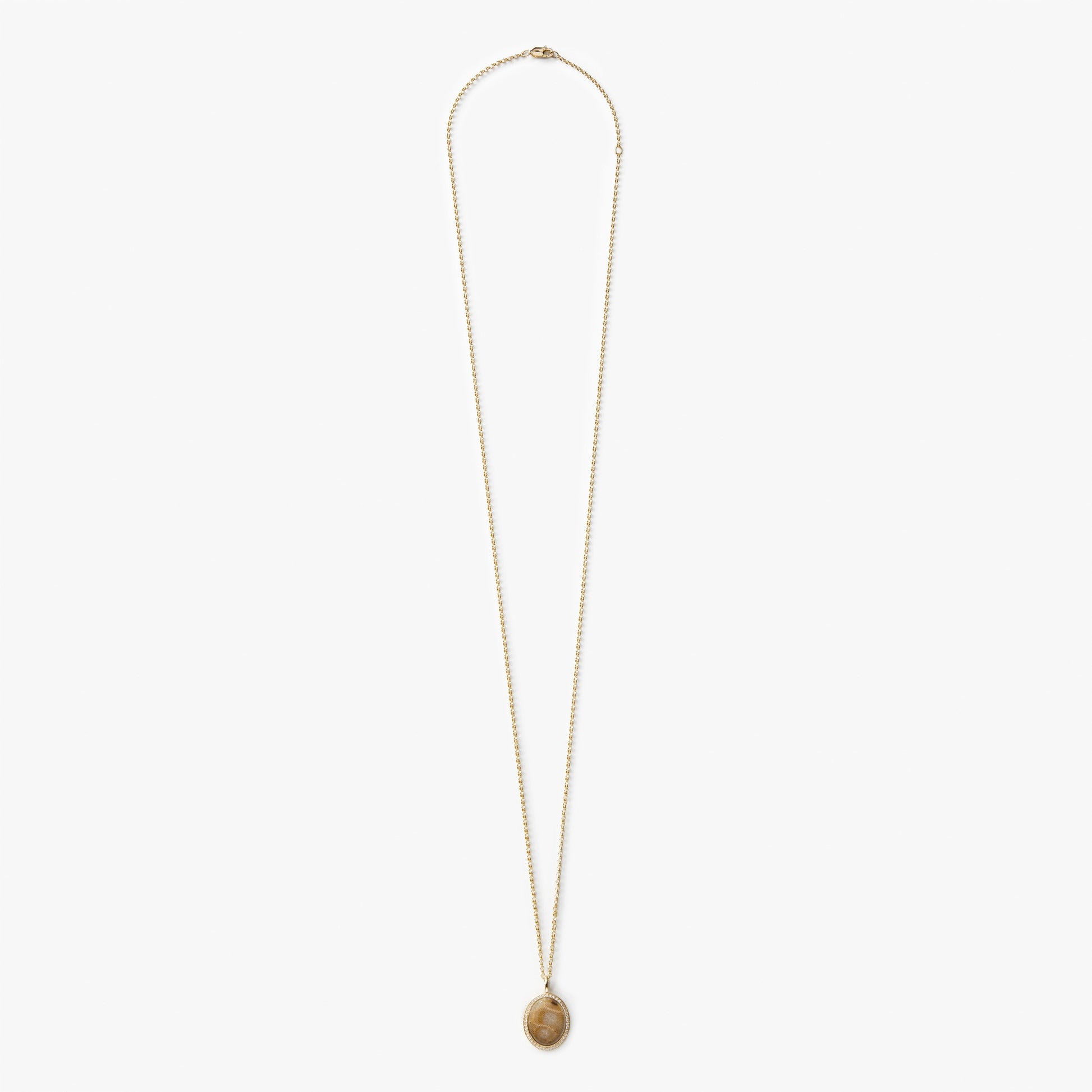 The Shinola Diamond Pave Petoskey Necklace in yellow gold features a round pendant with diamond accents, displayed on a plain white background.