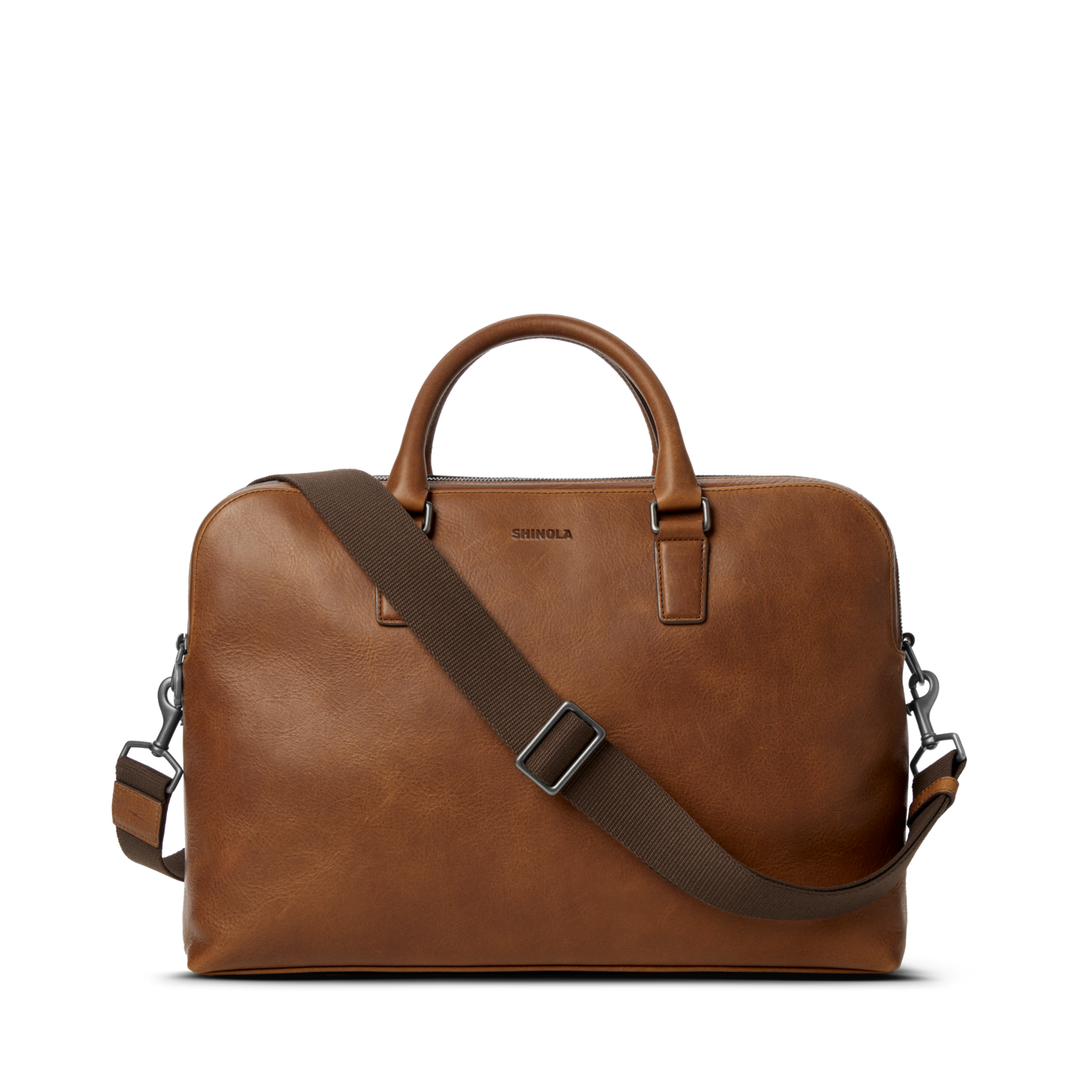 Shinola Double Zip Briefcase in medium brown leather with top handles and a dark brown adjustable, detachable shoulder strap, shown on a plain white background.