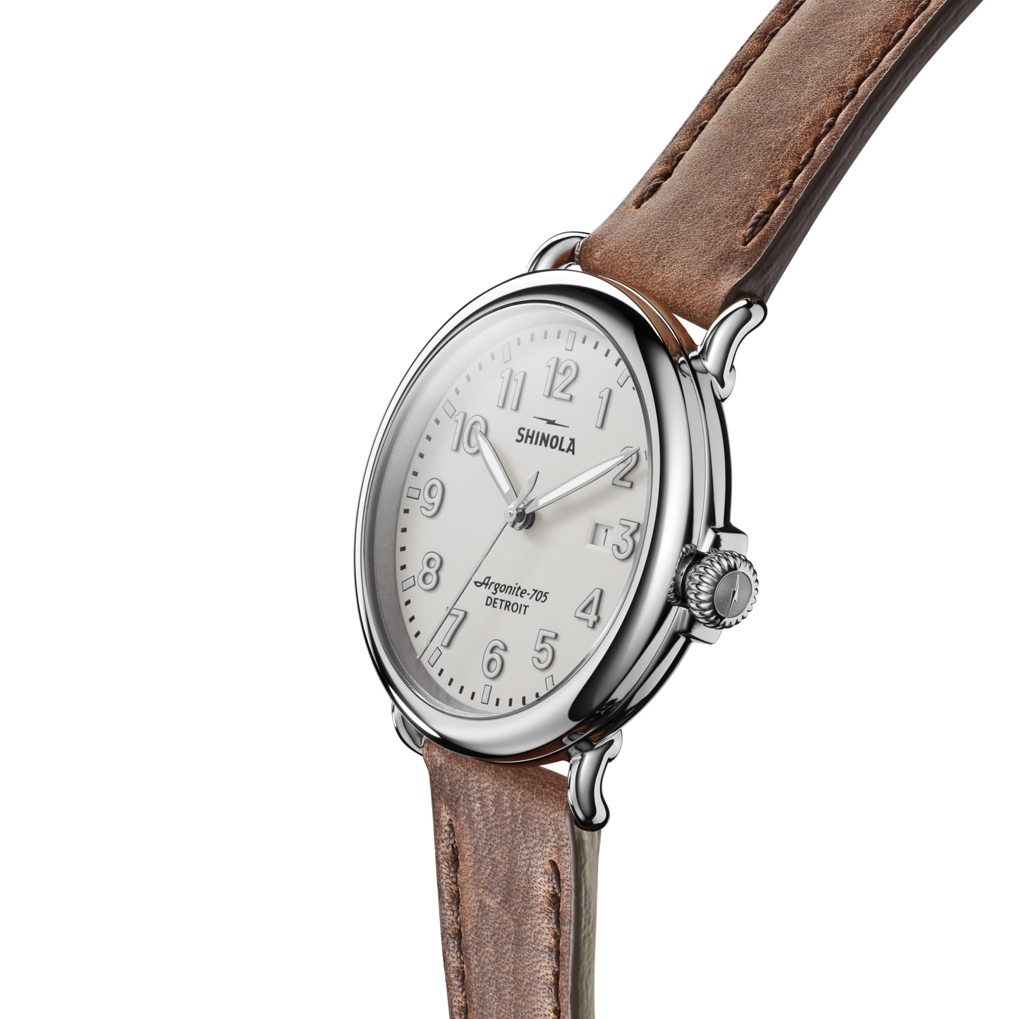 The Shinola Runwell Watch - Ivory features a round silver case, ivory dial with silver numbers, and a brown leather strap, displayed at an angle on a white background.