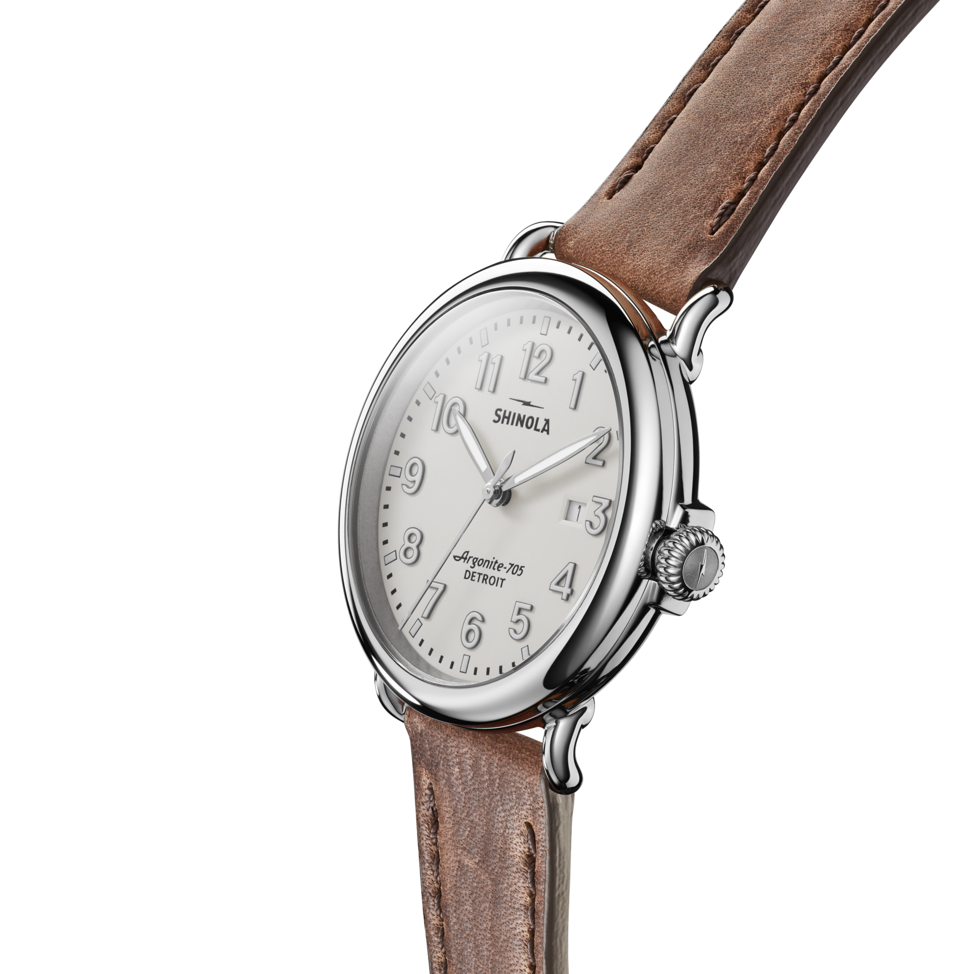 The Shinola Runwell Watch - Ivory features a round silver case, ivory dial with silver numbers, and a brown leather strap, displayed at an angle on a white background.