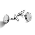 A pair of Shinola Coin Edge Cufflinks with round, sterling silver faces and textured edges is displayed on a white background.