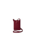 The Shinola Bixby Phone Crossbody in Ruby is a small, deep red natural leather bag with a slim strap, open top, and card slip pocket, shown against a plain white background.