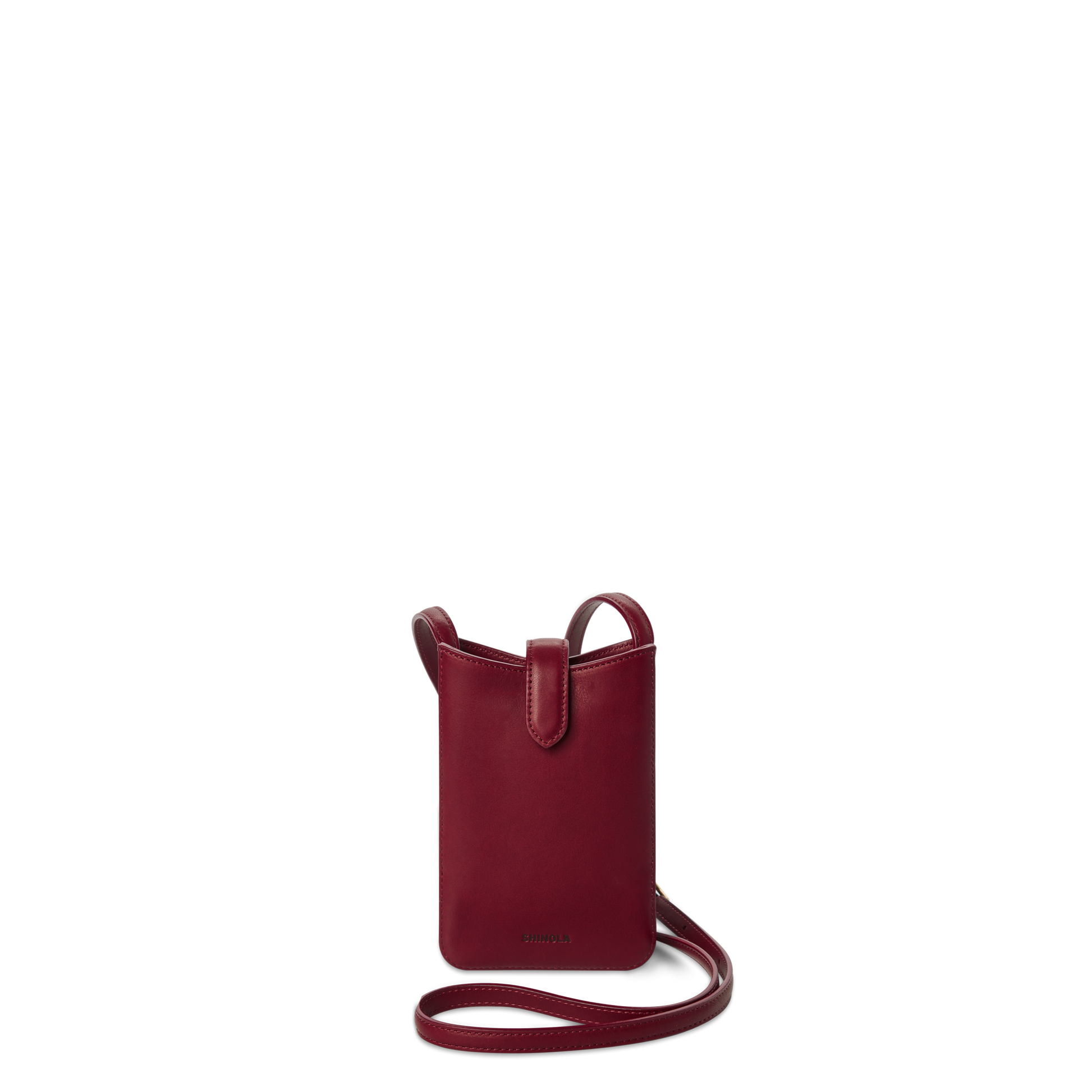 The Shinola Bixby Phone Crossbody in Ruby is a small, deep red natural leather bag with a slim strap, open top, and card slip pocket, shown against a plain white background.