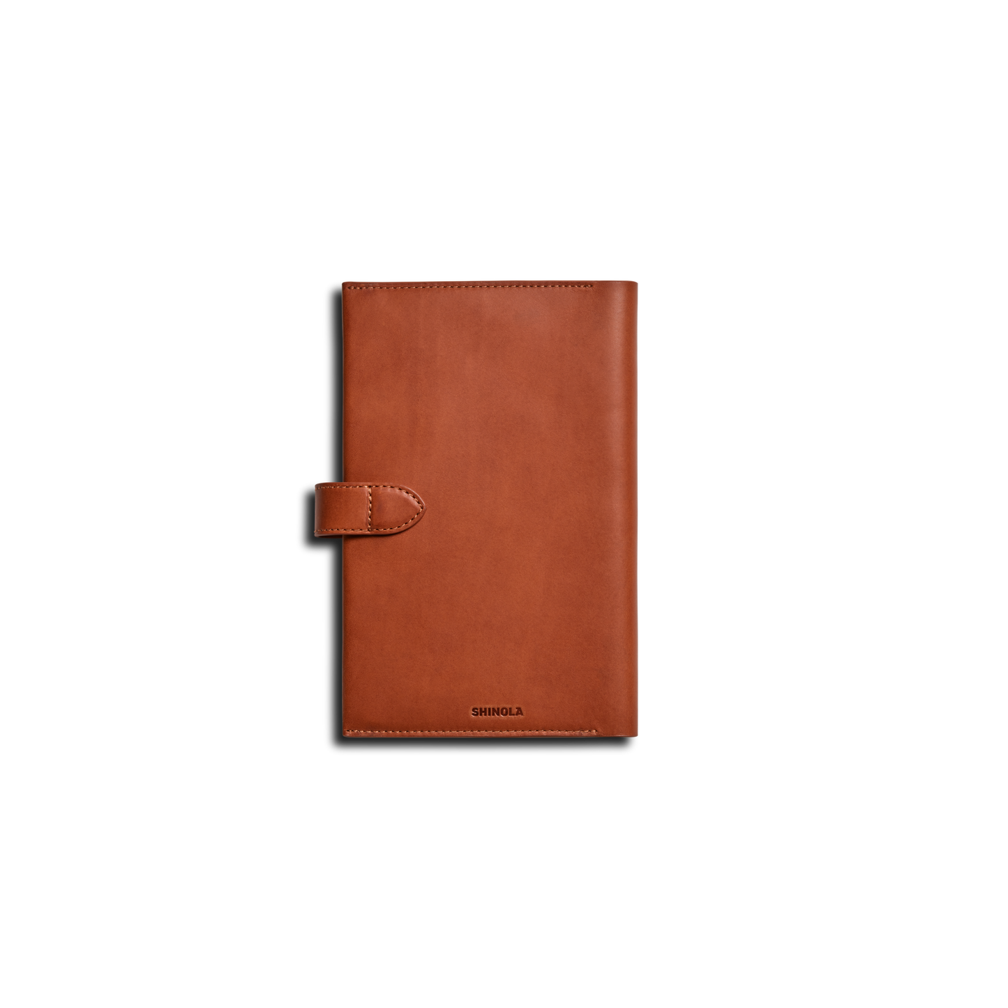 The Shinola Medium Snap Journal Cover in rust Italian leather features a snap closure and is shown vertically on a plain white background, with the brand name embossed near the bottom edge.