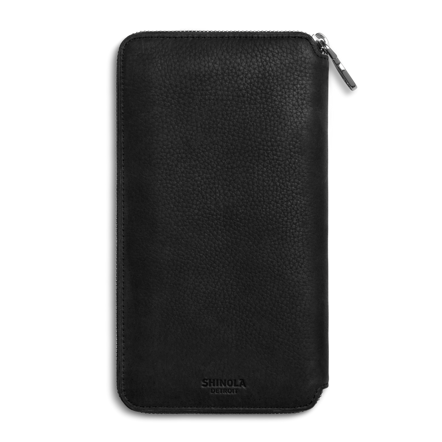 The Shinola Organizer Wallet - Black is crafted from natural grain leather with a textured finish and features the Shinola Detroit logo embossed at the bottom center. The zipper runs along the top and right sides, making it a sleek travel organizer.
