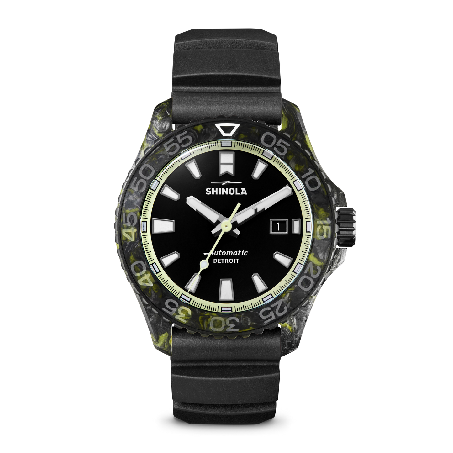 The Shinola Forged Carbon Monster Watch features a black dial with white hour markers, date display, luminous hands, a black and green marbled bezel, forged carbon case, black rubber strap, and Swiss automatic movement.