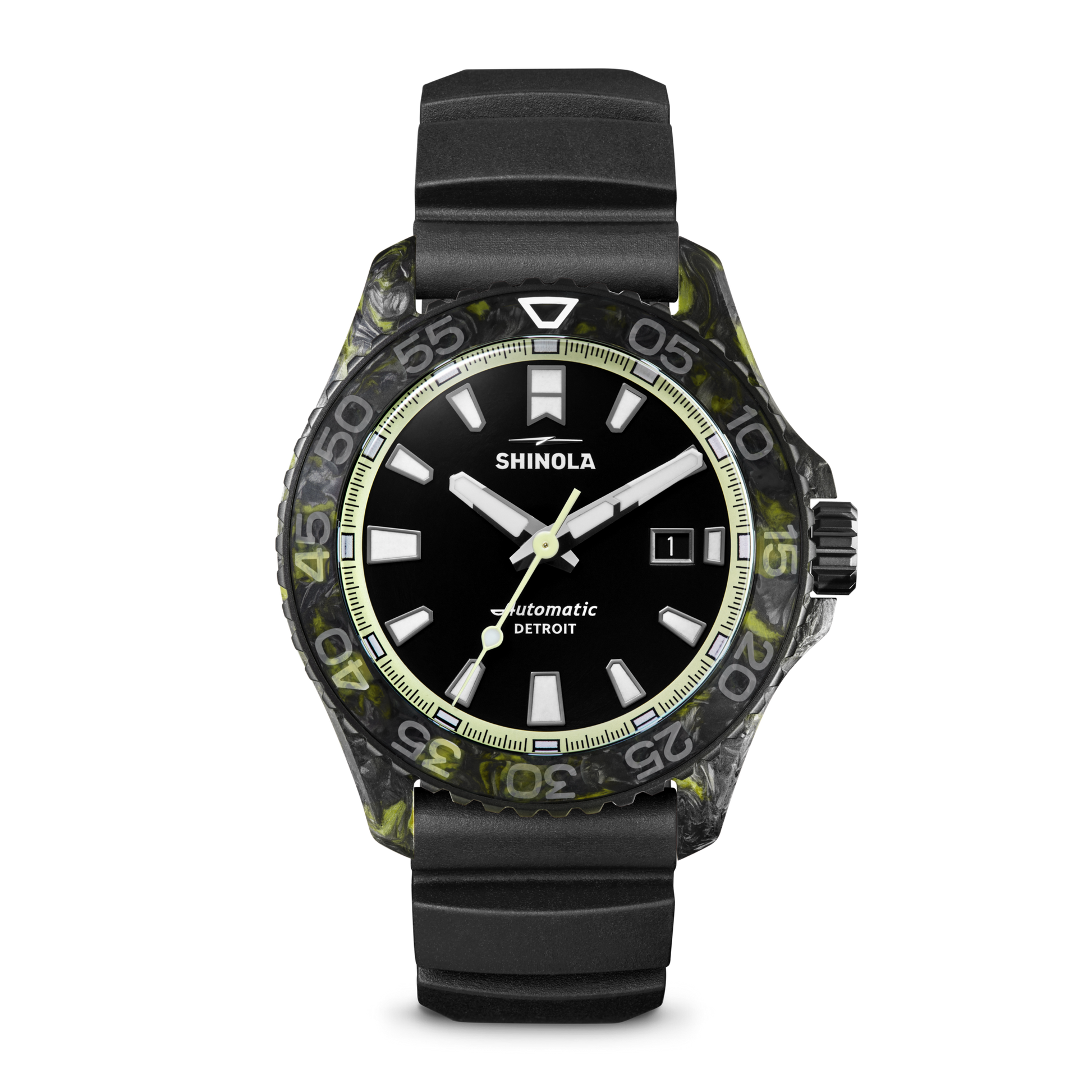 The Shinola Forged Carbon Monster Watch features a black dial with white hour markers, date display, luminous hands, a black and green marbled bezel, forged carbon case, black rubber strap, and Swiss automatic movement.