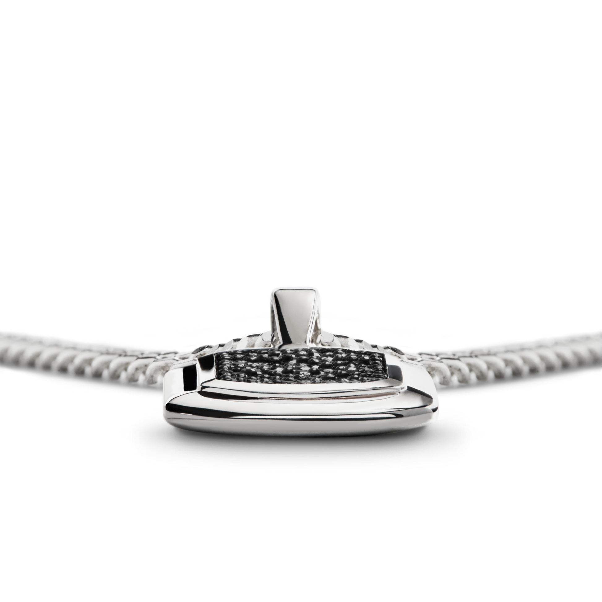 Close-up of the Shinola Black Diamond Pave Tag Necklace, a sterling silver piece with a rectangular pendant featuring black diamonds at the center, shown on a white background.