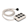 The Shinola 5 Port Power Supply - Cream features a black and white braided cord, five round outlets, two USB A/C ports, and a rectangular base, all shown on a white background.