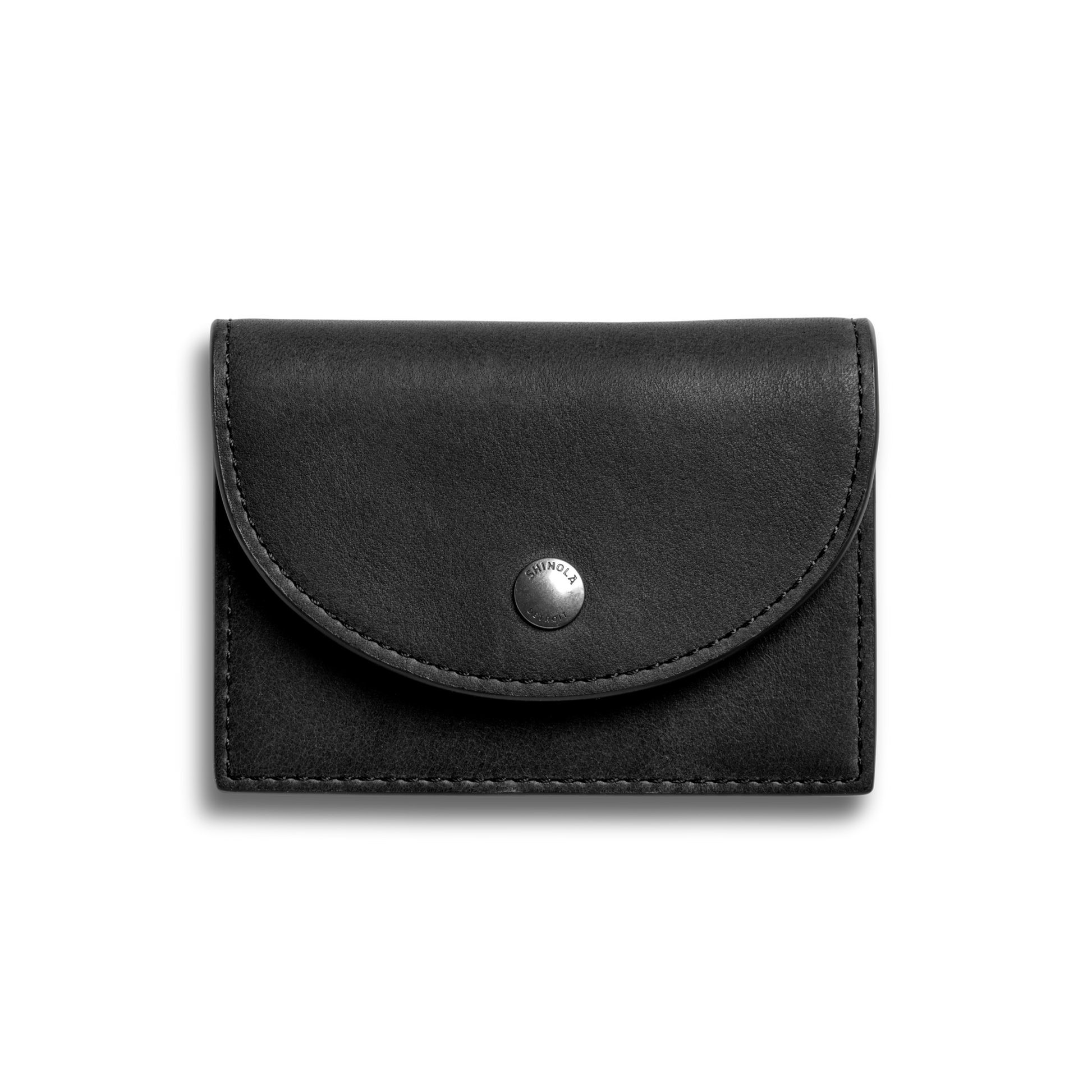 The Birdy Accordion Card Holder by Shinola in black natural leather features card pockets and a curved flap with a silver snap button, showcased on a plain light gray background.