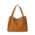 The Shinola Derby Tote Bag - Tan is a large, natural leather tote with wide shoulder straps and a minimalist design, ideal for everyday use. Shown here against a plain white background.