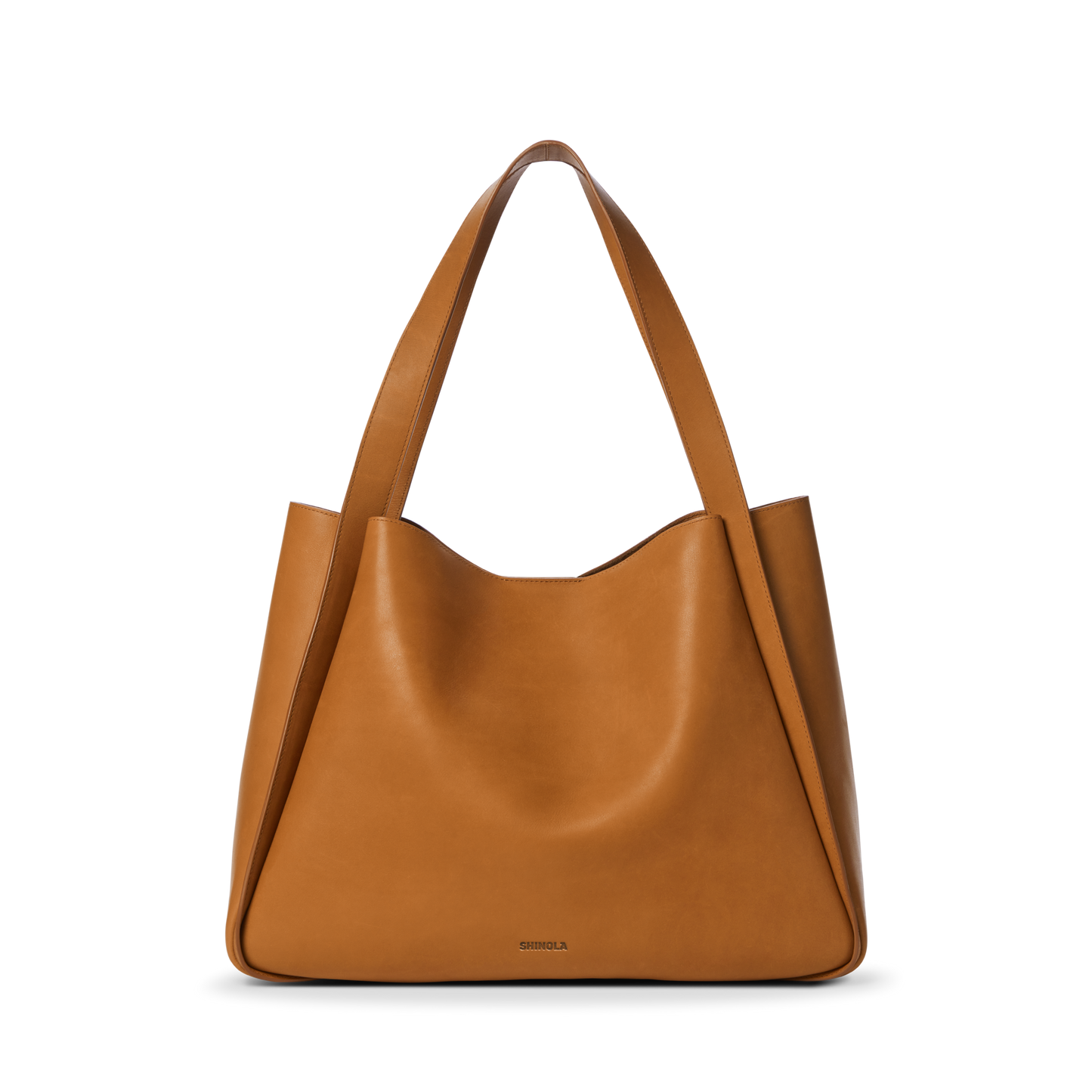 The Shinola Derby Tote Bag - Tan is a large, natural leather tote with wide shoulder straps and a minimalist design, ideal for everyday use. Shown here against a plain white background.
