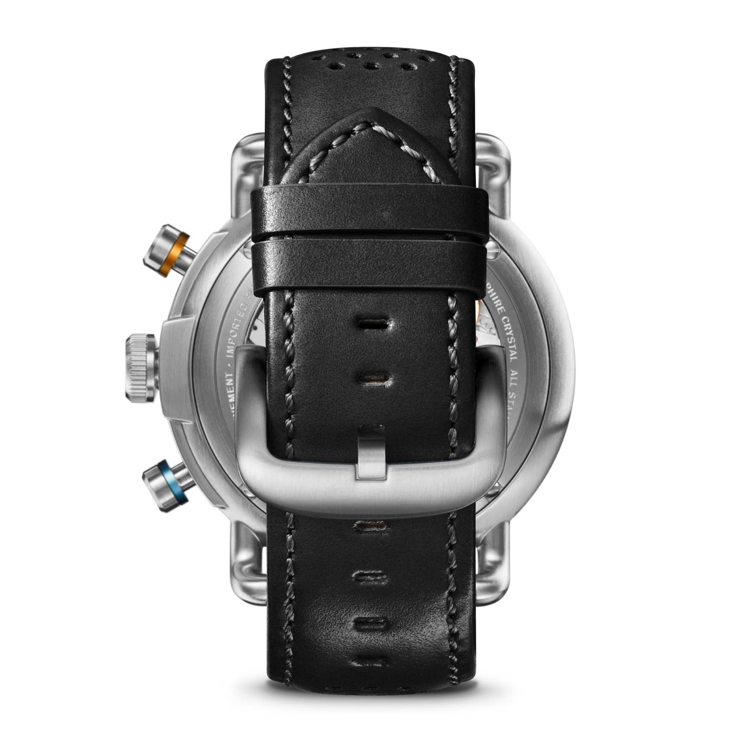 A close-up of the Shinola Canfield Speedway Open Road Automatic Chronograph Watch in black shows the black leather strap with visible stitching, silver buckle, and metal case with three colored buttons—highlighting its Swiss-made automatic movement.