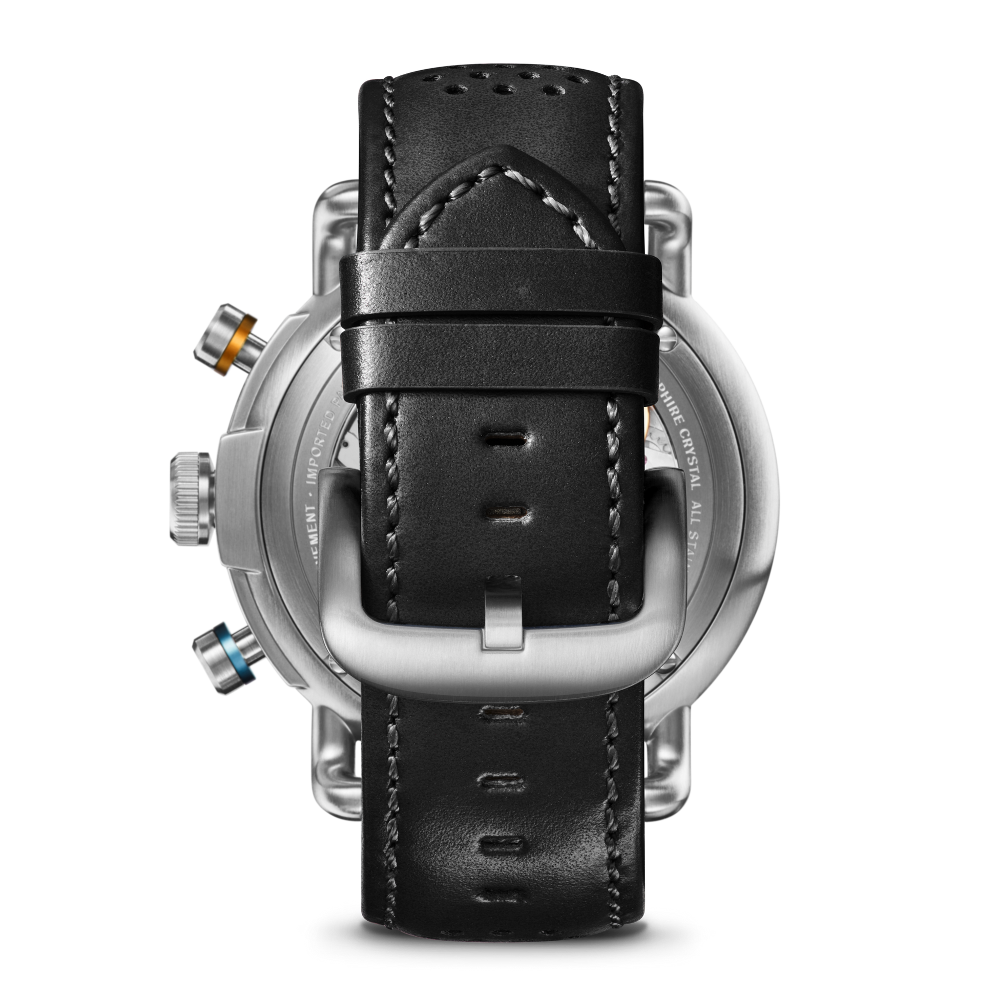 A close-up of the Shinola Canfield Speedway Open Road Automatic Chronograph Watch in black shows the black leather strap with visible stitching, silver buckle, and metal case with three colored buttons—highlighting its Swiss-made automatic movement.