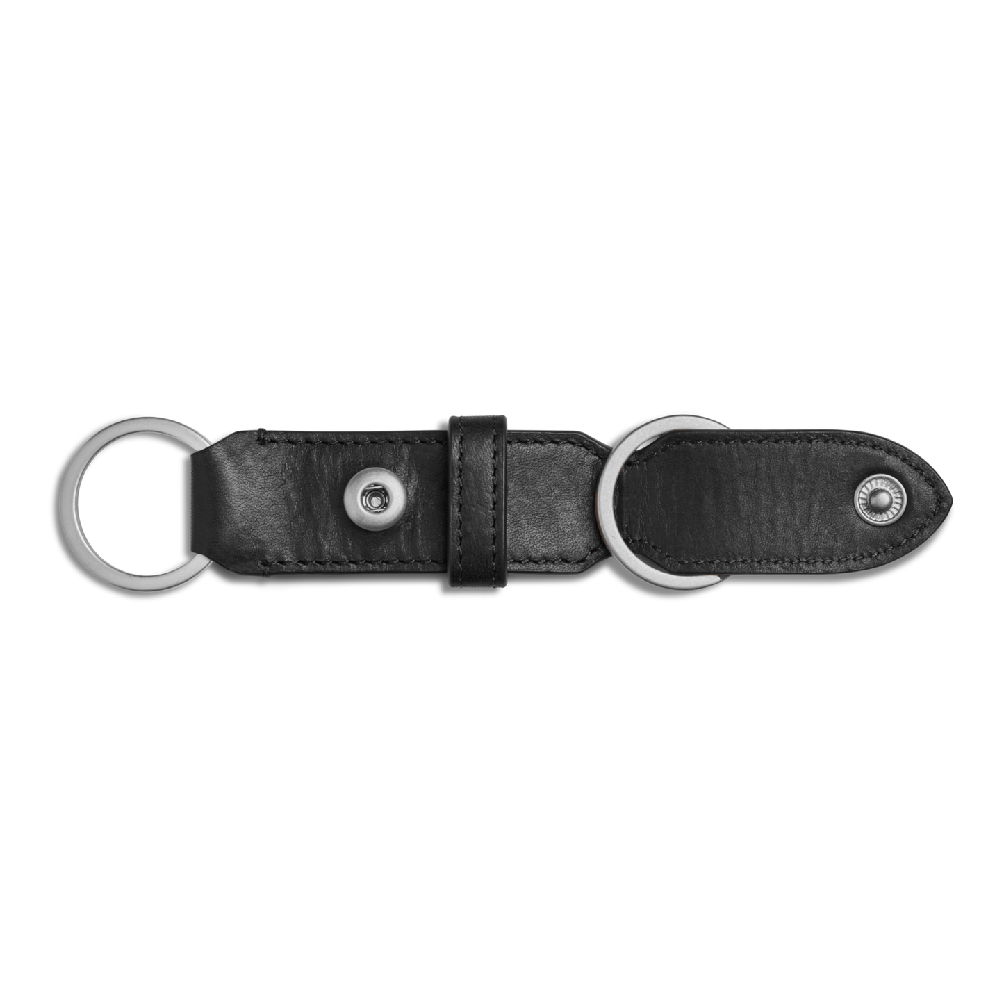 The Shinola Leather Valet Key Fob in black features two silver metal rings at each end and a central snap button, displayed on a plain white background.