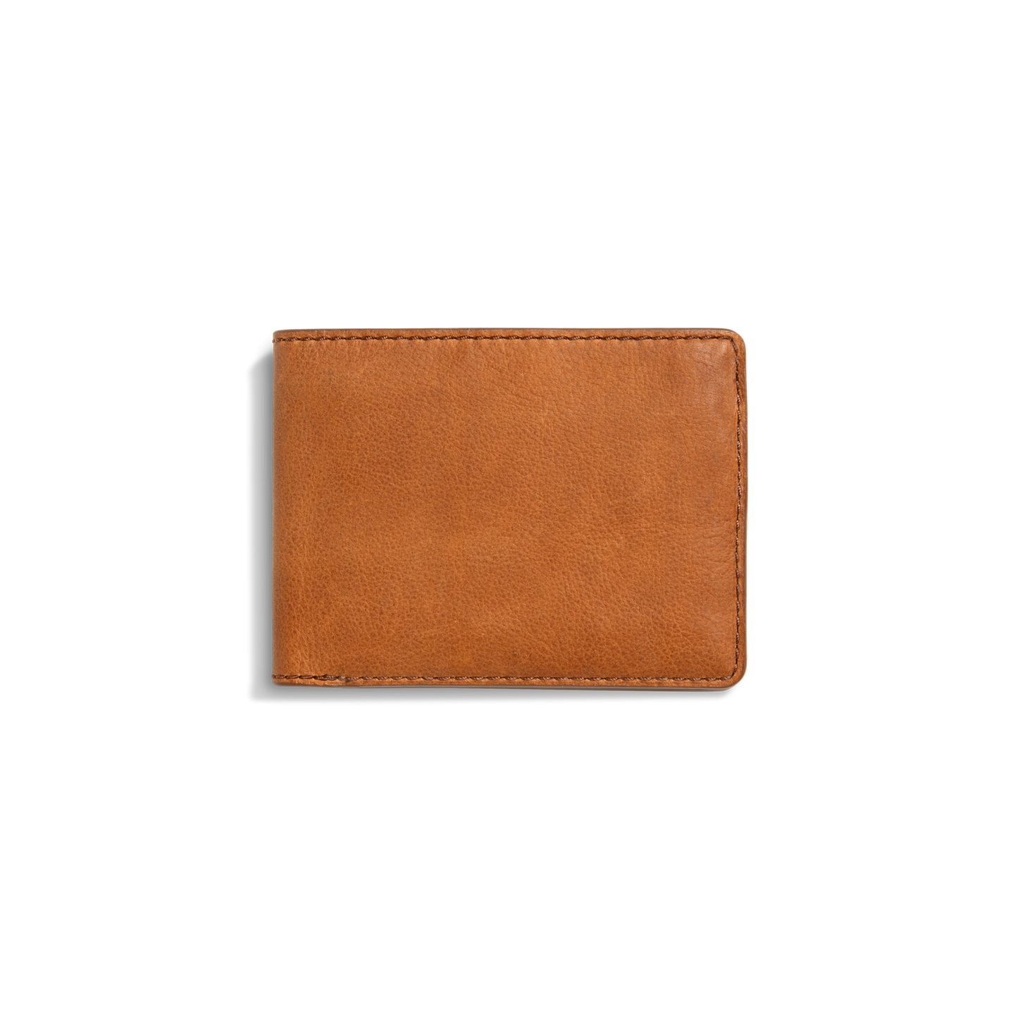 The Shinola Slim Bifold Wallet - Tan is shown closed against a white background, featuring premium light brown leather, visible edge stitching, and a simple, classic design.