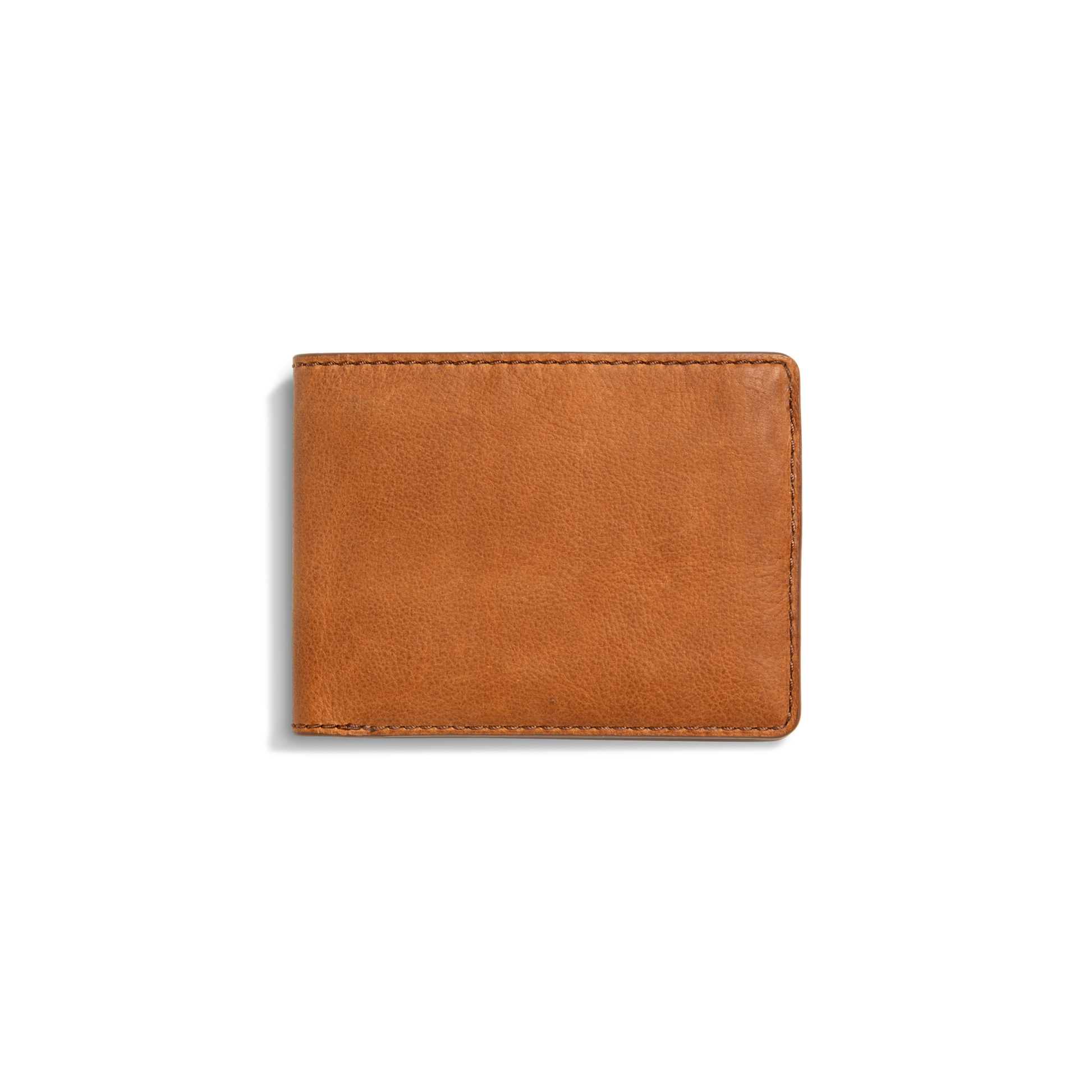 The Shinola Slim Bifold Wallet - Tan is shown closed against a white background, featuring premium light brown leather, visible edge stitching, and a simple, classic design.